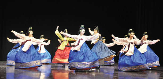 Folk artists performing a dance. 