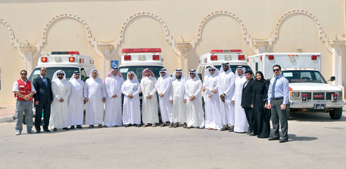 QP officials and representatives of the charitable organisations with the ambulances.