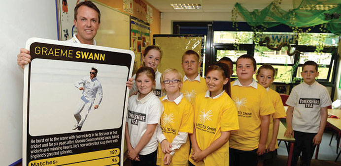 Graeme Swann with children at an event for charity Chance to Shine, which promotes cricket in British schools, in Nottingham.