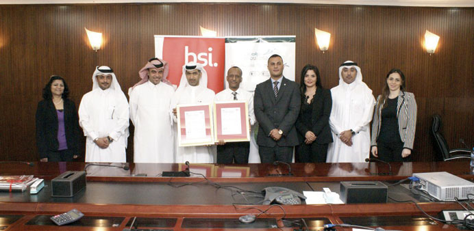 Mowasalat officials receive the BSI certifications.