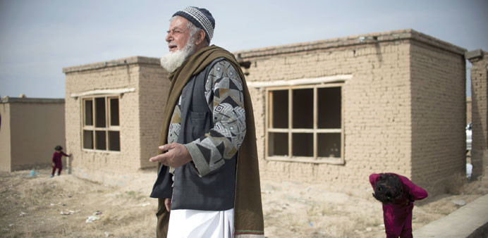 Afghan man, Mohamed Khoja, 79, stands amongst empty houses in Aliceghan, some 30km north of Kabul.